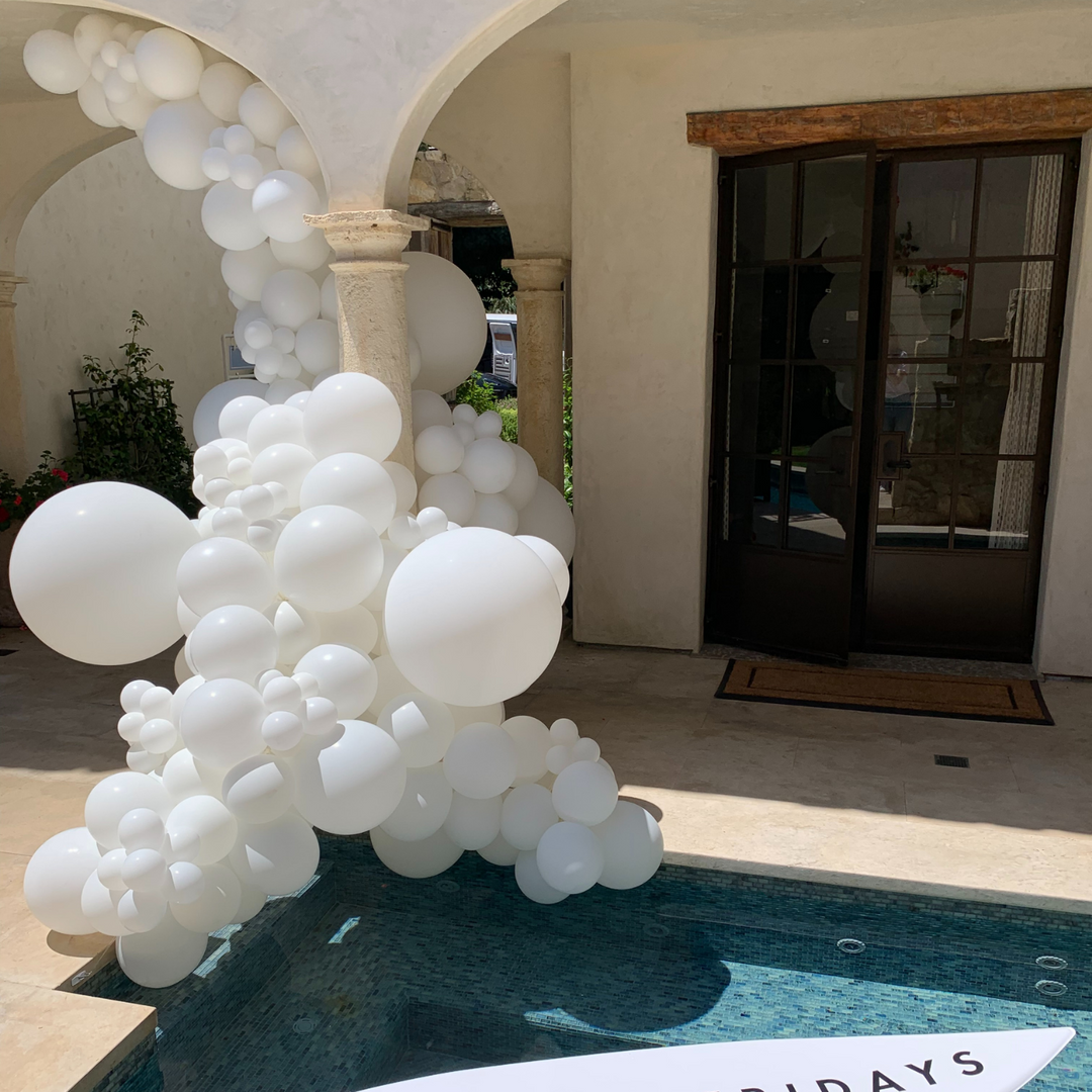 White balloon garland outdoor balloon decoration ideas by pool party - Los Angeles balloon installation