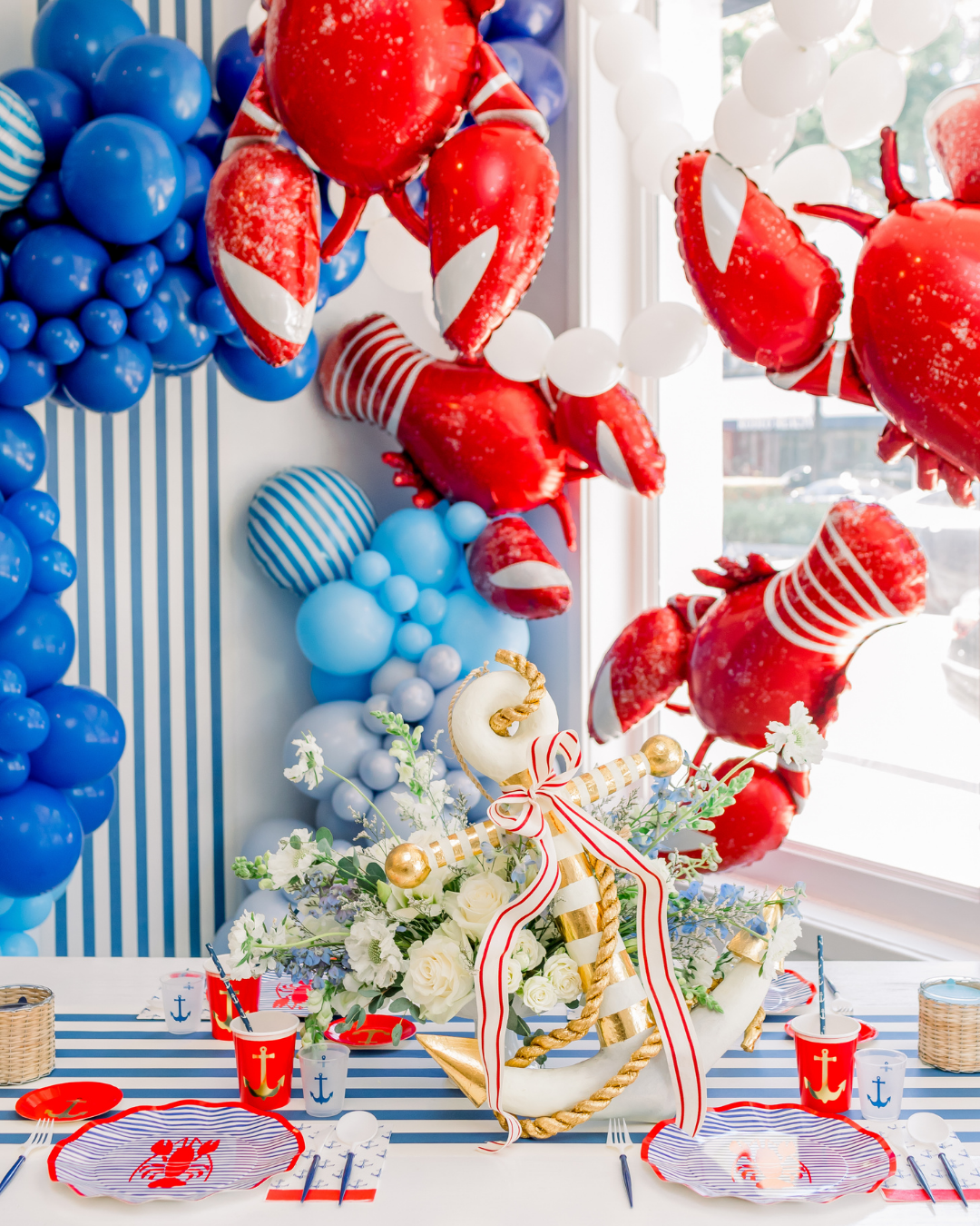 nautical party ocean theme blue and white stripes anchors sailboats seaside decorations