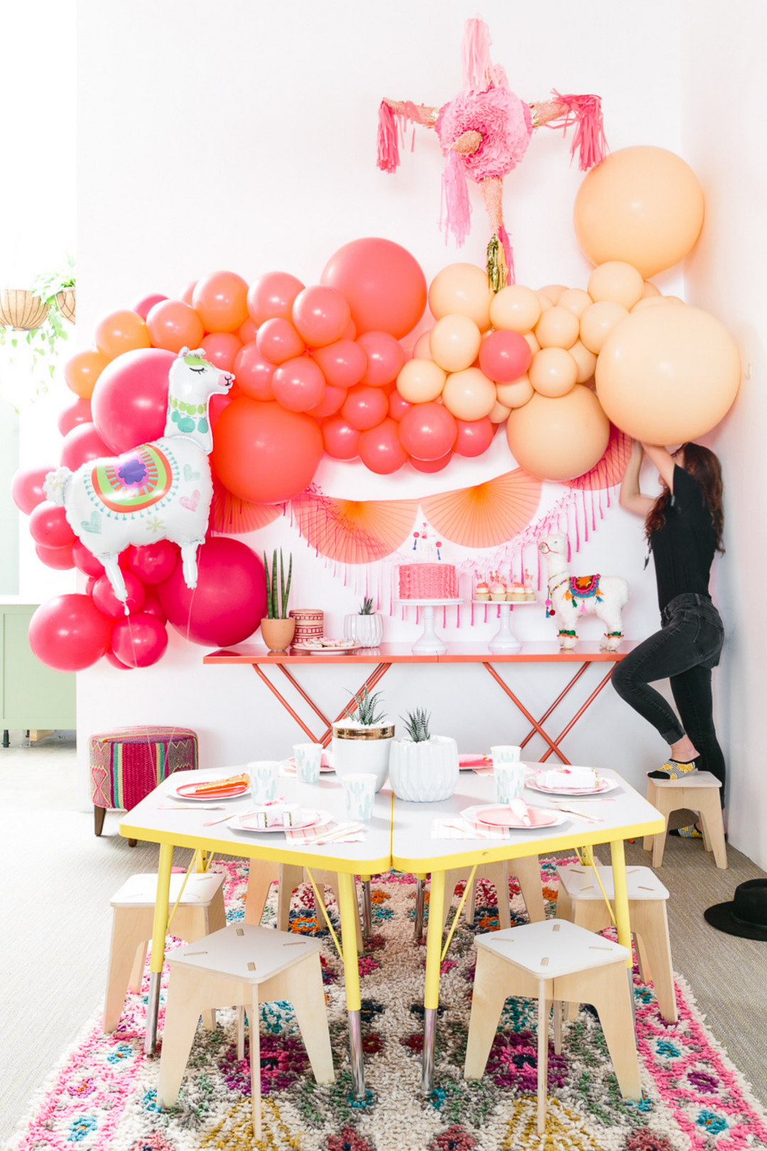 Pink and peach balloon garland with fiesta decorations - Los Angeles balloon installation