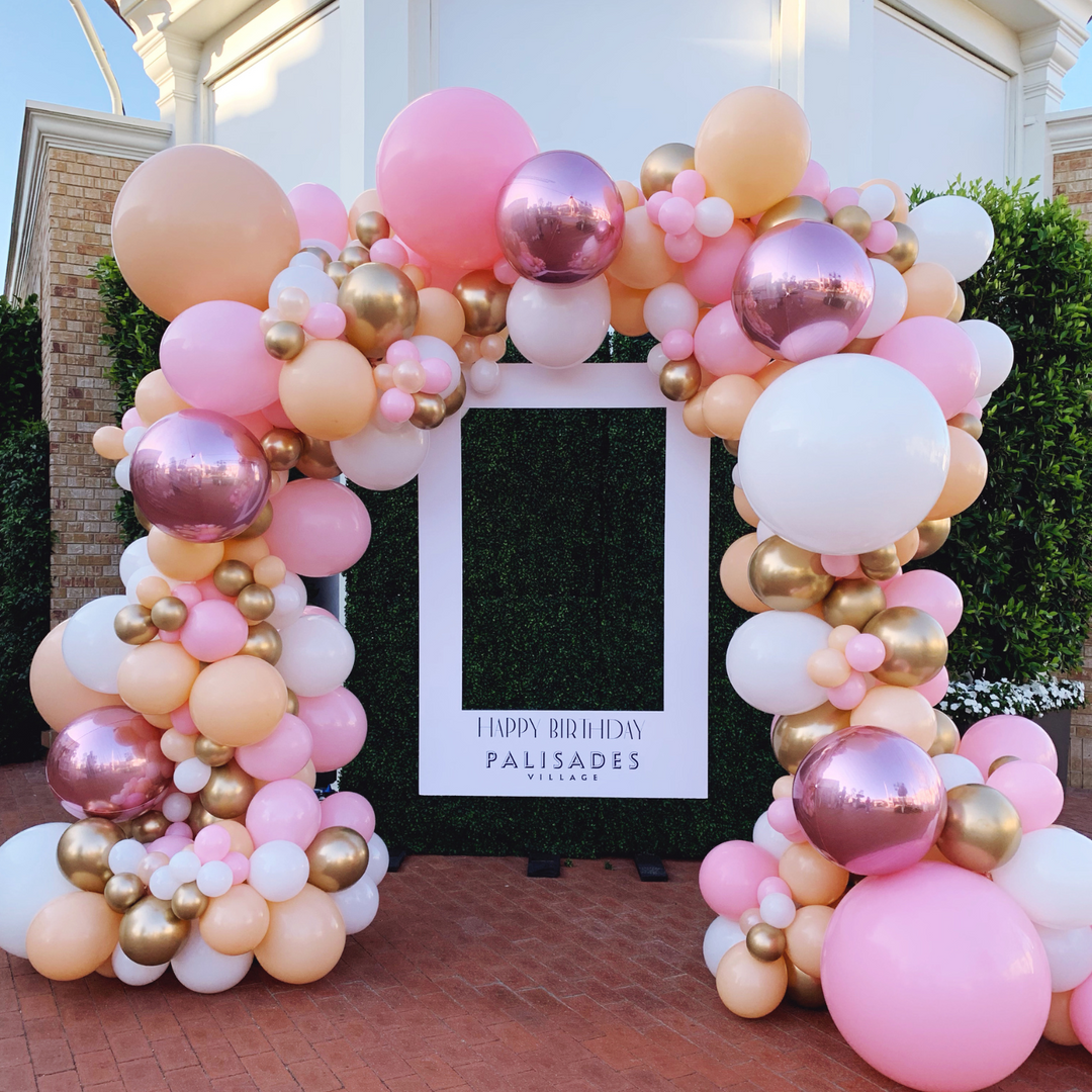 Pink and rose gold balloon garland arch balloon decoration ideas - Los Angeles balloon installation