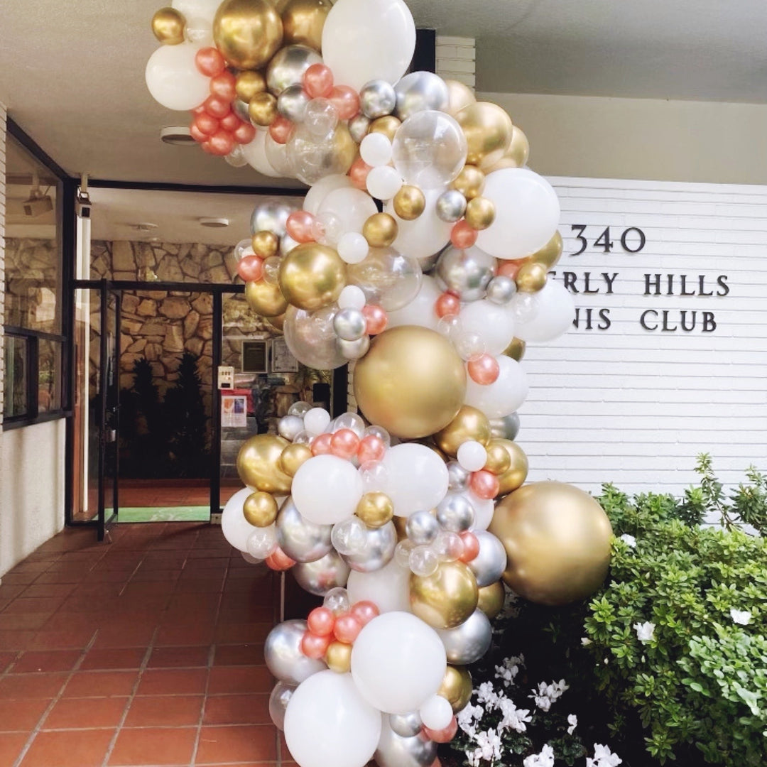 Silver, gold, and champagne balloon garland champagne balloon decoration ideas - Los Angeles balloon installation