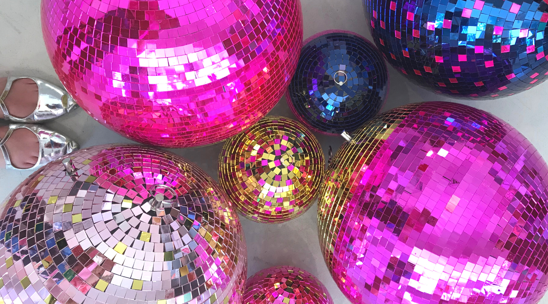 Disco balls used as disco party decorations.