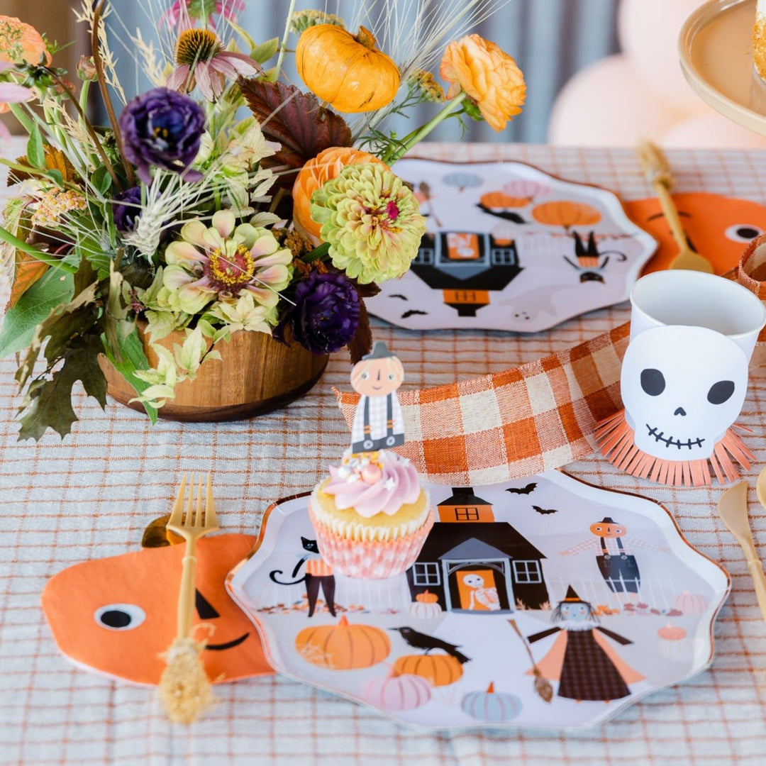 Falloween tablescape including tableware and party decorations perfect for fall and halloween