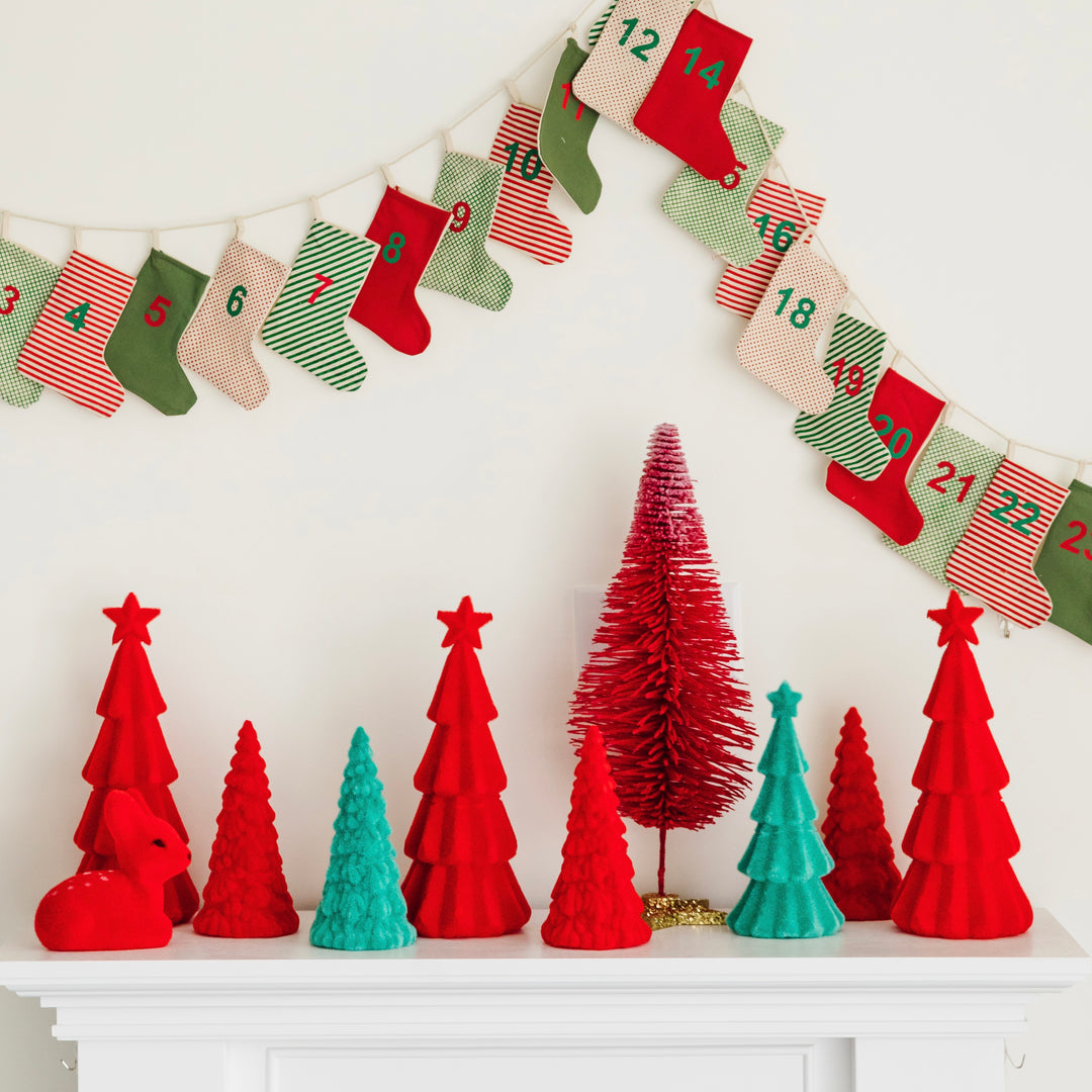 Christmas and holiday home decor including christmas village houses and colorful christmas trees