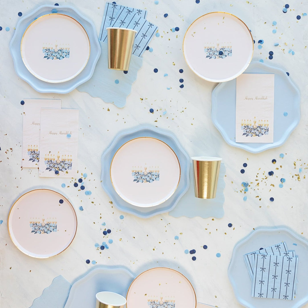 Sky blue napkins with a bow pattern for a coquette, baby shower, or birthday party