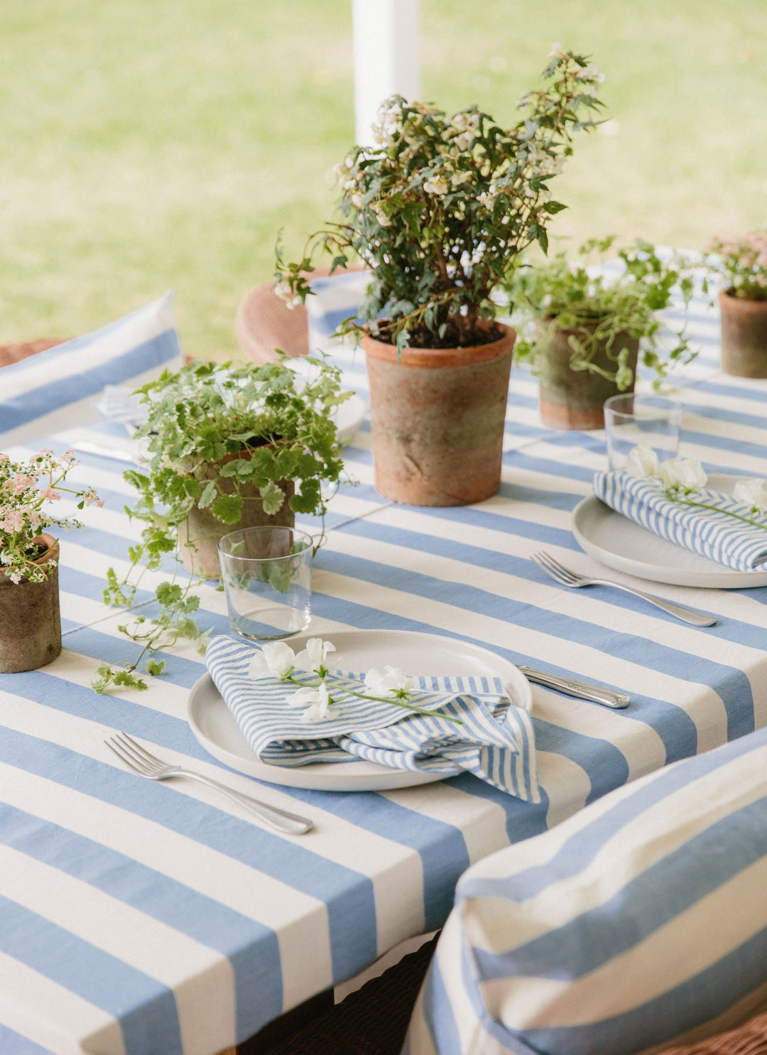 Heather Taylor Home woven stripe table linens styled with napkins for a spring or summer table.