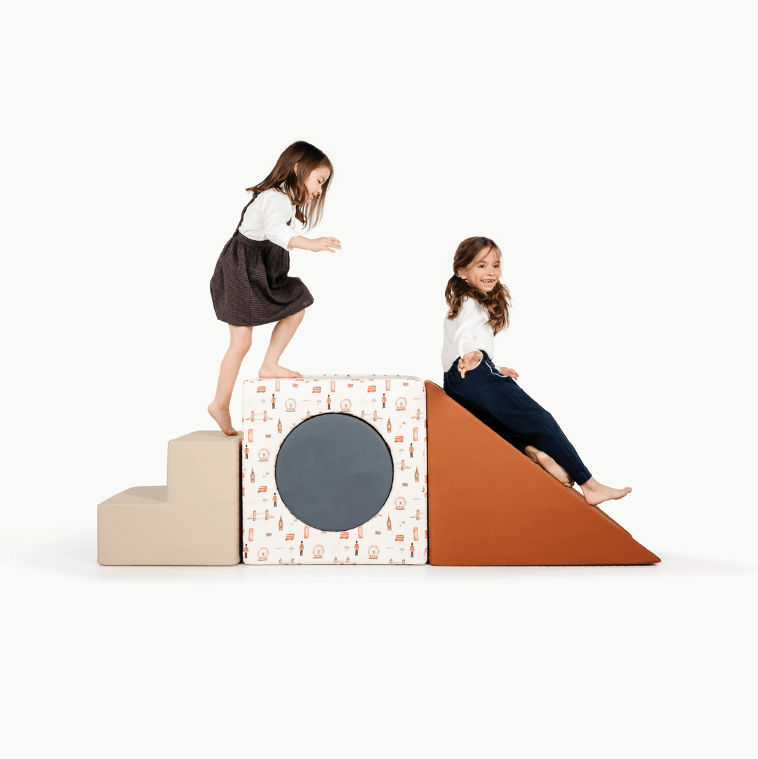 Gathre block playset with foam steps, a cube, and a triangle ramp in cream London print and rust