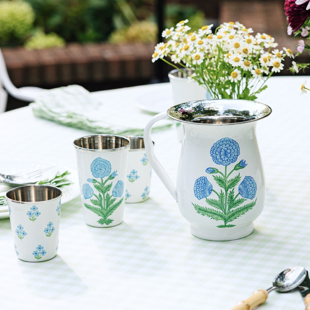 Poppy Blue tall enamelware tumblers by Trudie, a set of four tall enamel tumblers in a blue poppy pattern