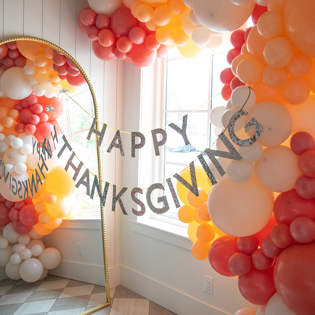 Liberty Happy Thanksgiving garland styled at a pumpkin pie party with balloons and harvest decor
