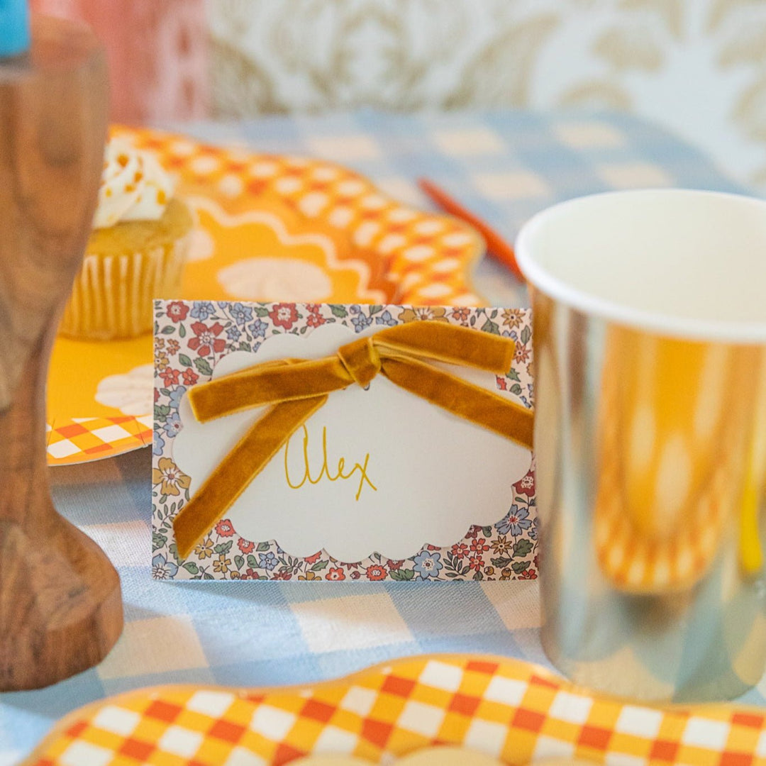 Liberty floral place card set on a pumpkin pie themed Thanksgiving table with coordinating napkins