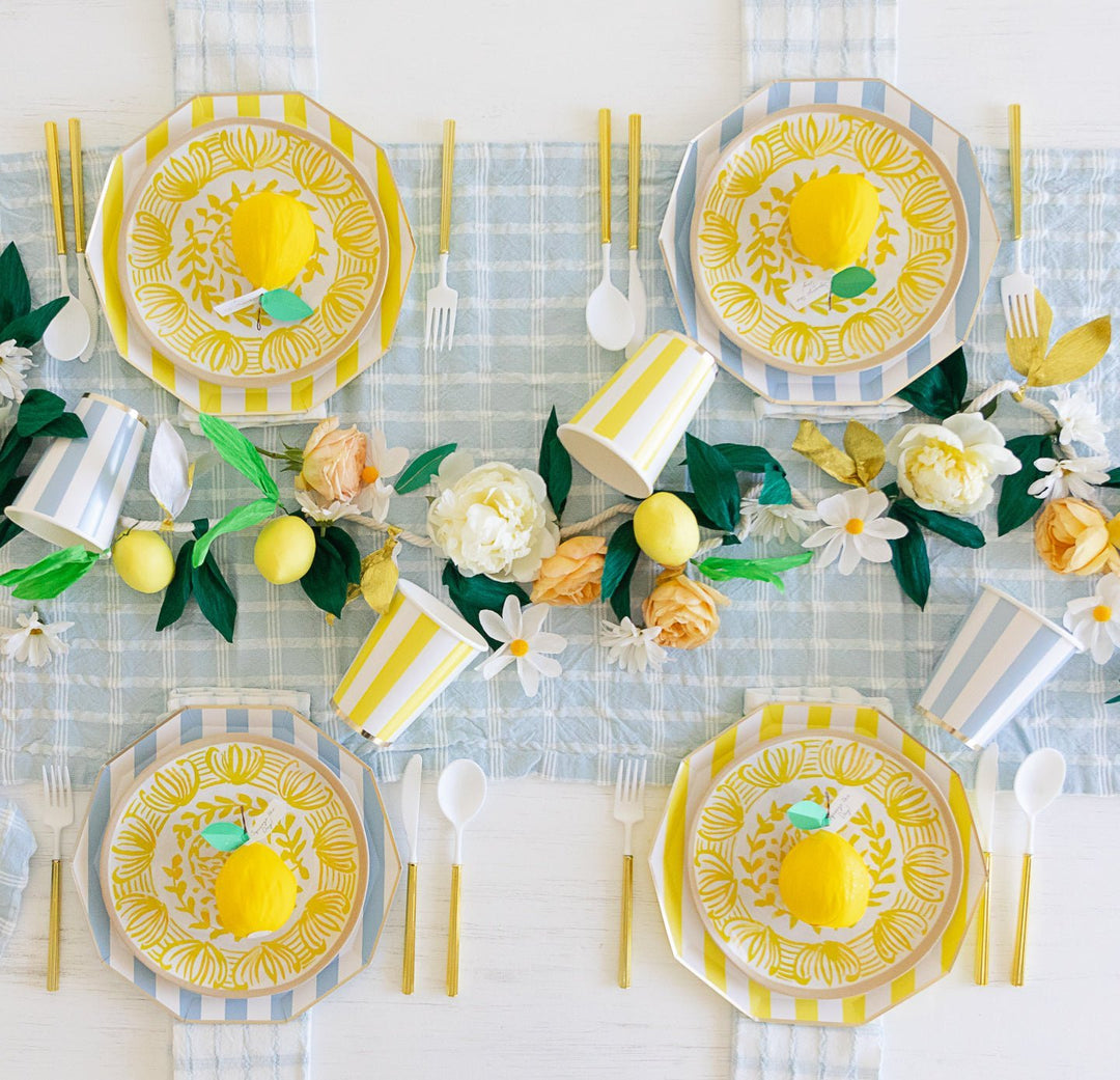 Yellow and white cabana stripe large party plates for a summer, birthday, or sunshine celebration