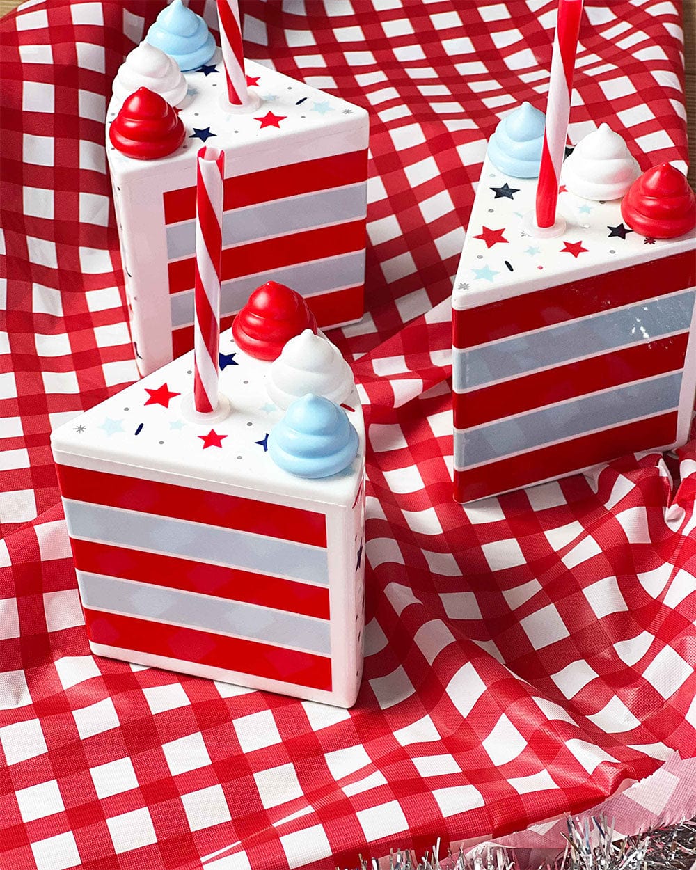 Patriotic cake slice cups with red and white stripes on a red gingham tablecloth