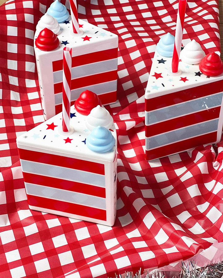 Patriotic cake slice cups with red and white stripes on a red gingham tablecloth