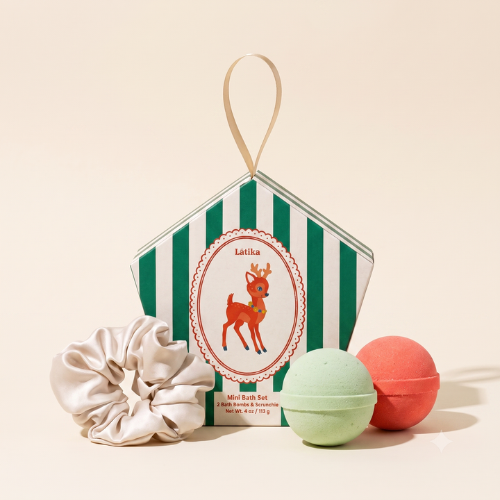 Green striped ornament box with retro deer, green and coral mini bath bombs and champagne scrunchie for Christmas