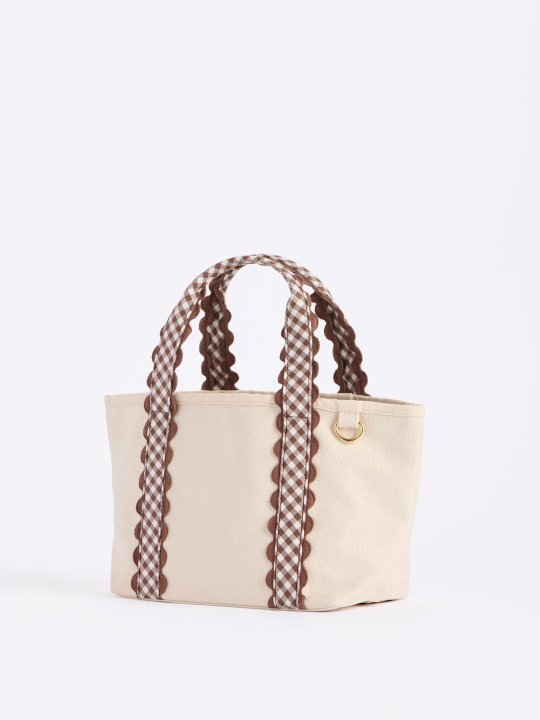 Beige handbag with plaid handles on a white background