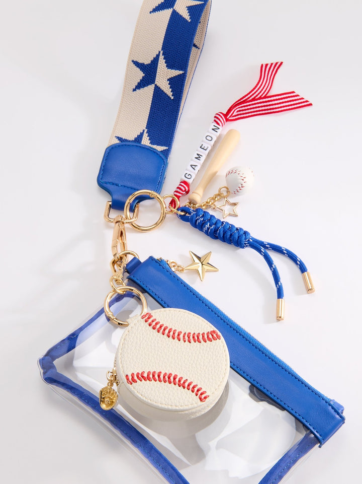 A baseball-themed keychain pouch set featuring a clear zippered pouch with a blue trim, a round baseball coin purse, a blue and beige patterned wrist strap, gold-tone hardware, and small baseball and wooden bat charms on a white background.