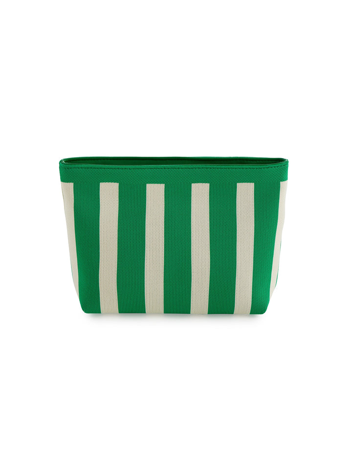 Green and white striped fabric basket on a white background