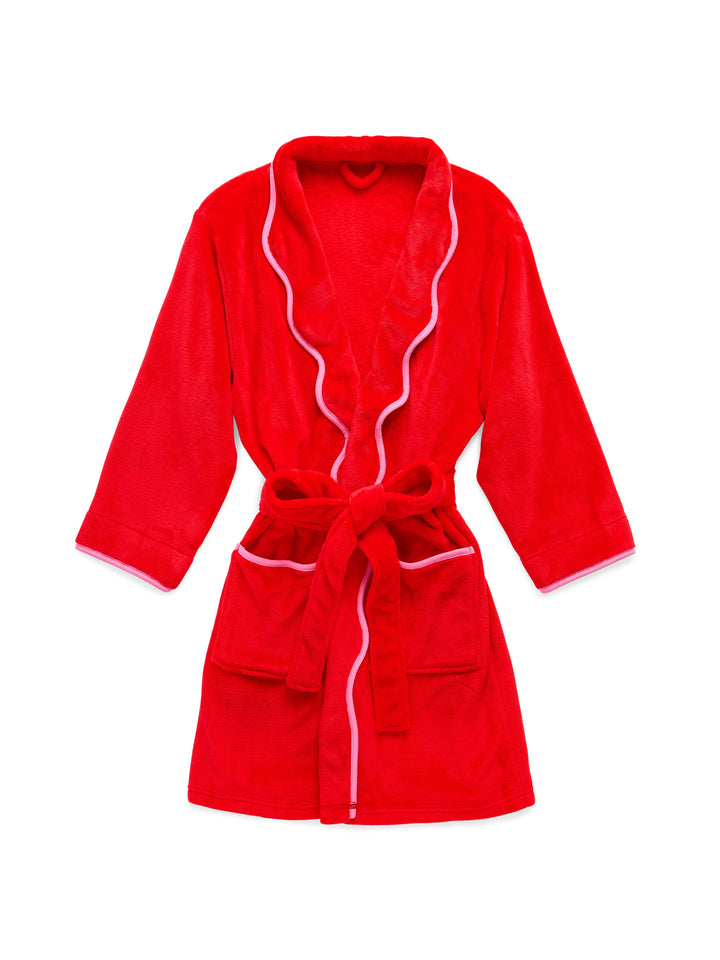 Red plush robe with pink scalloped trim laid flat on white