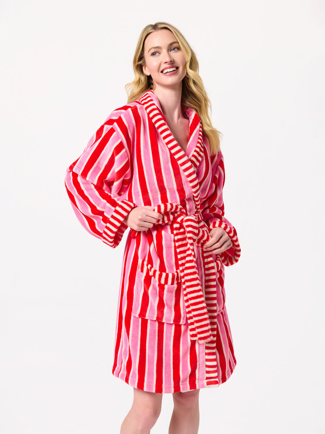 Smiling woman wearing the pink and red striped Christmas robe