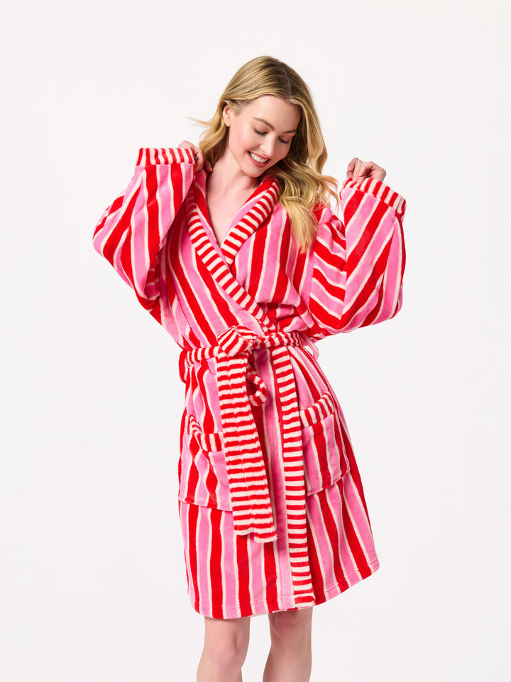 Woman in a pink and red striped plush robe
