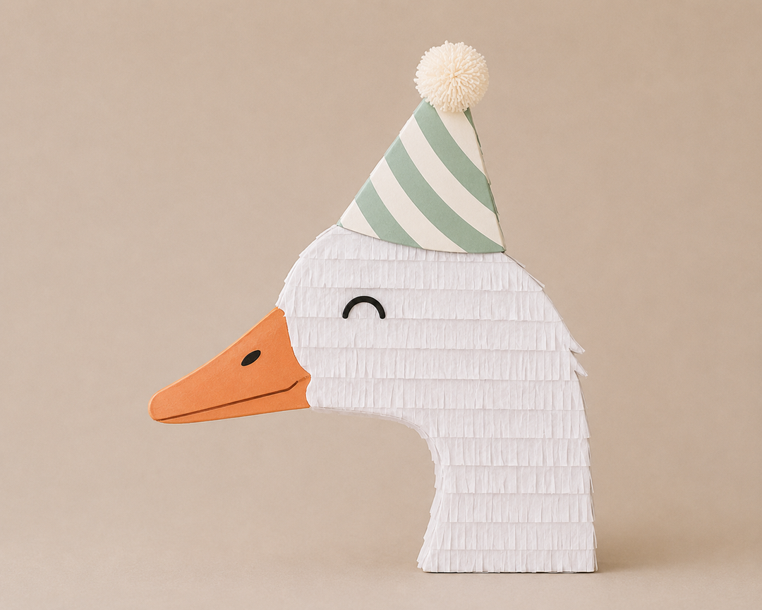 White goose piñata in a green striped party hat with a cream pom-pom and orange beak, for a farm birthday or baby shower