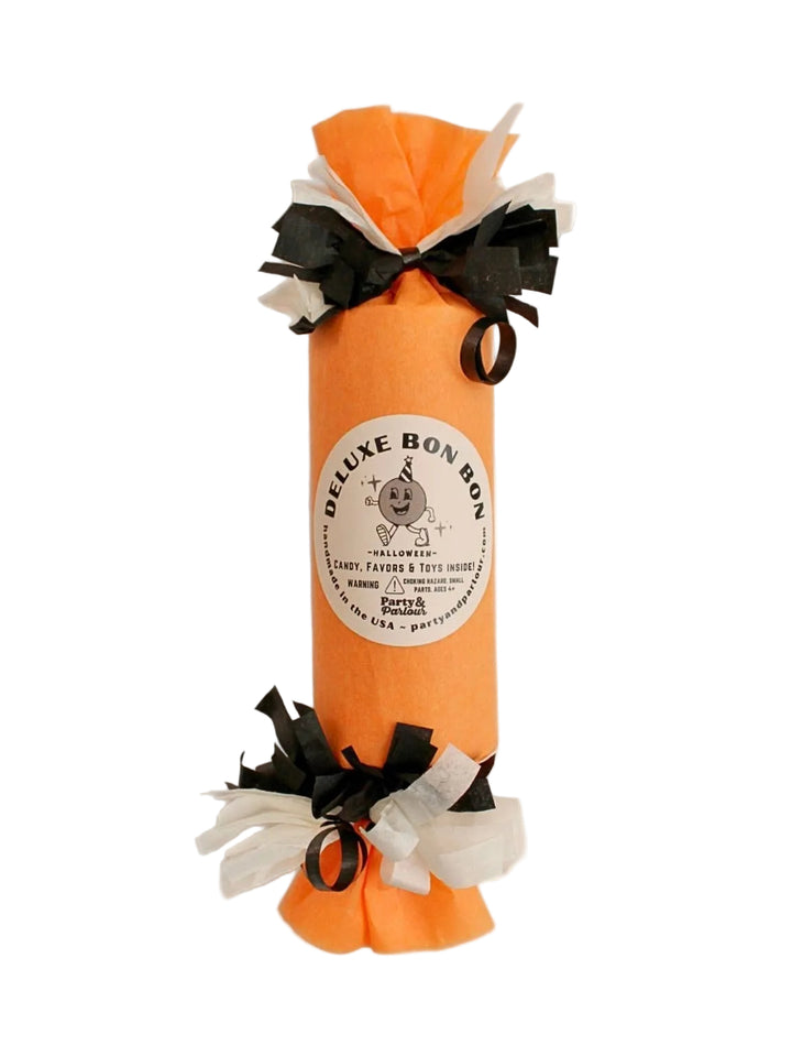 Orange deluxe Halloween surprise bon bon with black and white tissue fringe for pumpkin carving parties