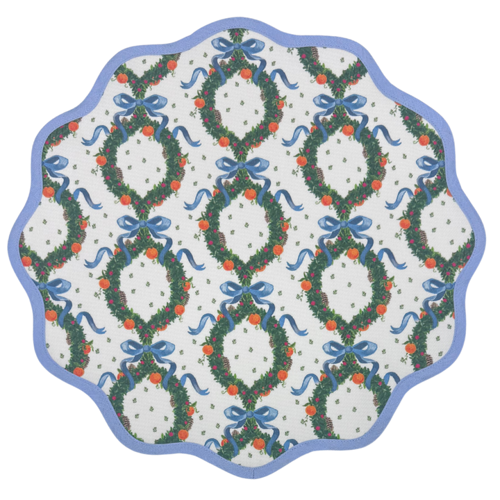 Round scalloped placemat in the Holiday Wreath print, Cornflower Blue, from Frances Fields Home