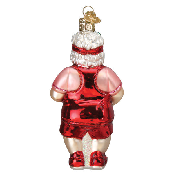 Back of the Mrs. Claus pickleball ornament showing her pink tee and red shorts, on white