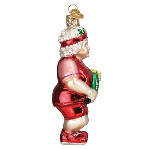 Side of the Mrs. Claus pickleball ornament with her paddle held at her waist