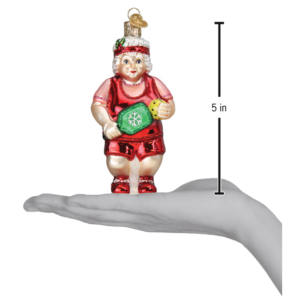 Pickleball Mrs. Claus ornament on an open palm beside a 5 inch height marker