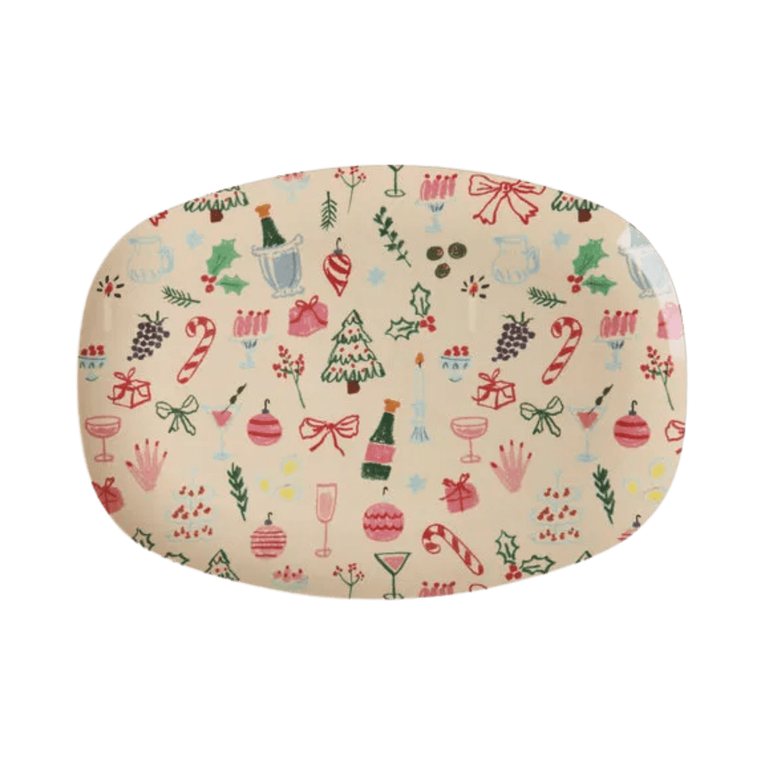 Rectangular cream melamine plate in Xmas Galore print of champagne, candy canes, trees, bows, and ornaments, top view