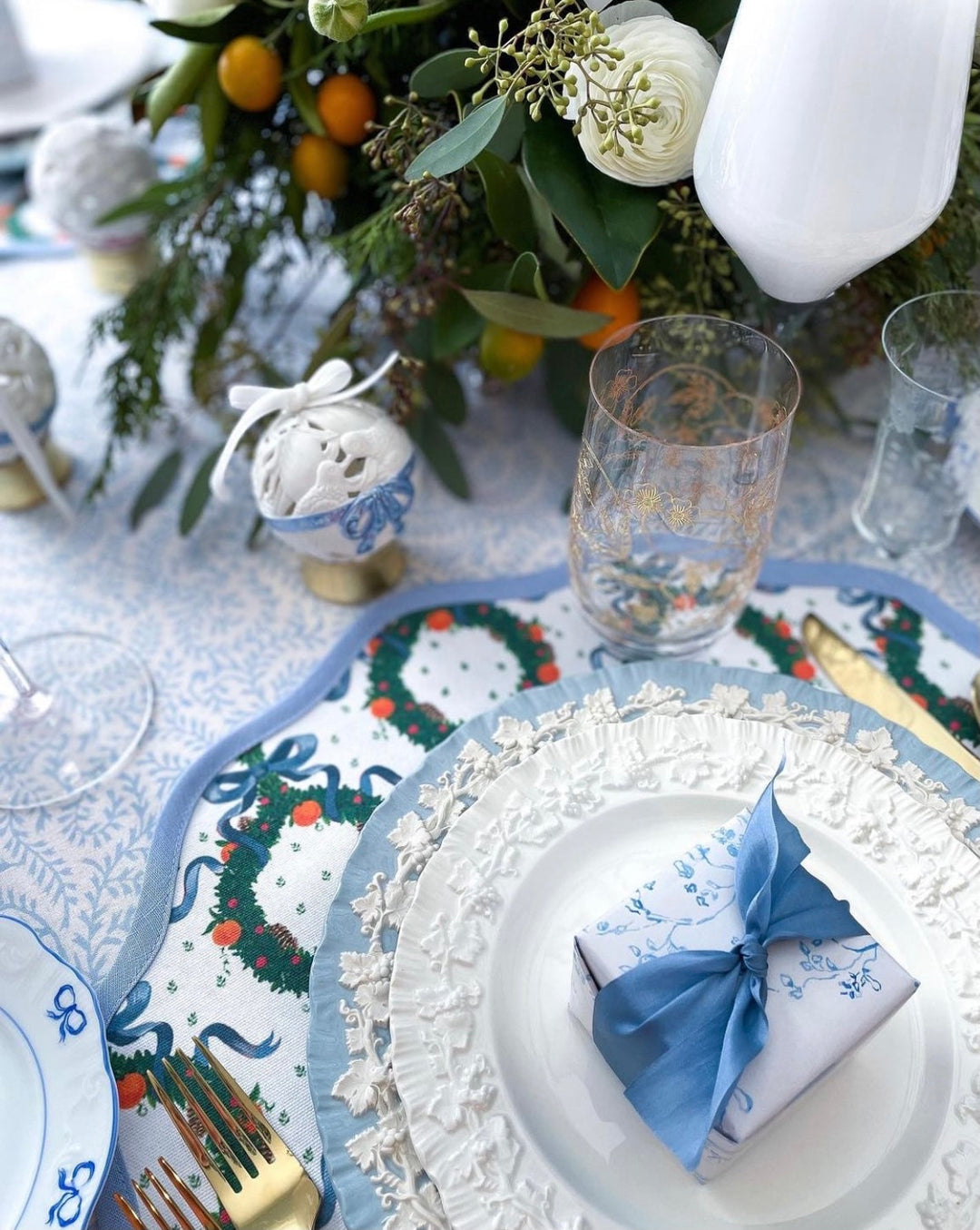 Scalloped round Christmas placemat in cornflower blue, for a holiday table setting