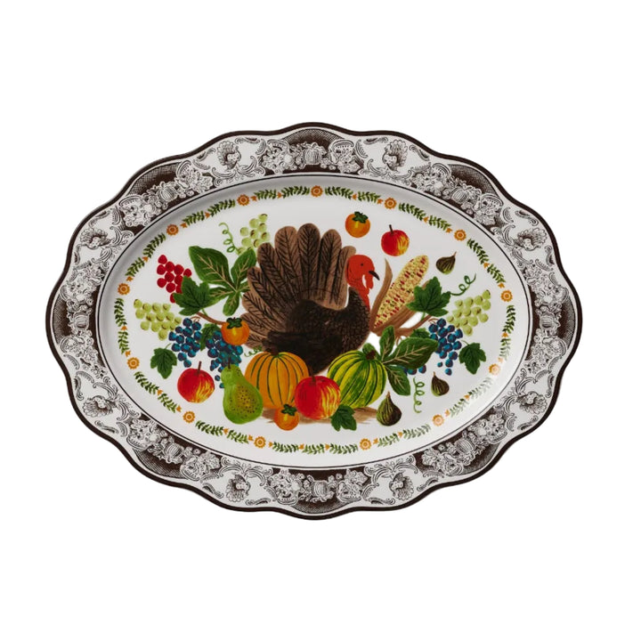 Oval porcelain turkey platter with scalloped brown toile border and harvest fruit illustration for Thanksgiving dinner