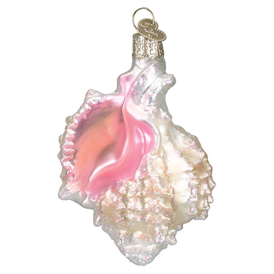 Front of the Mexican shell glass ornament with pink glitter opening and pearly white ridges, on white