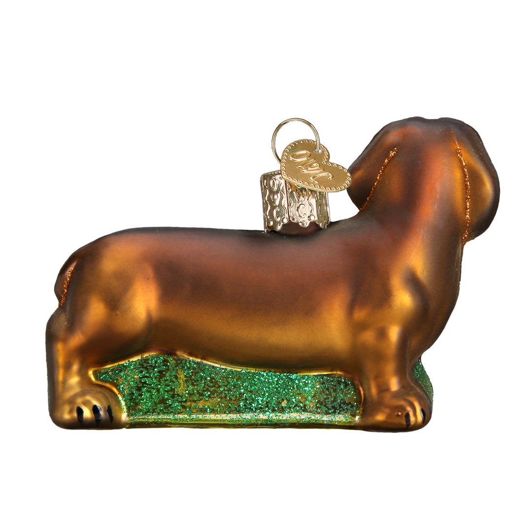 Opposite side view of the dachshund ornament showing its long body and tail