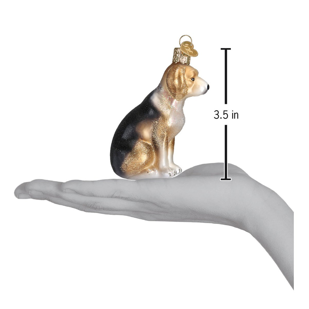 Beagle ornament on an open palm with a 3.5 inch height marker for scale