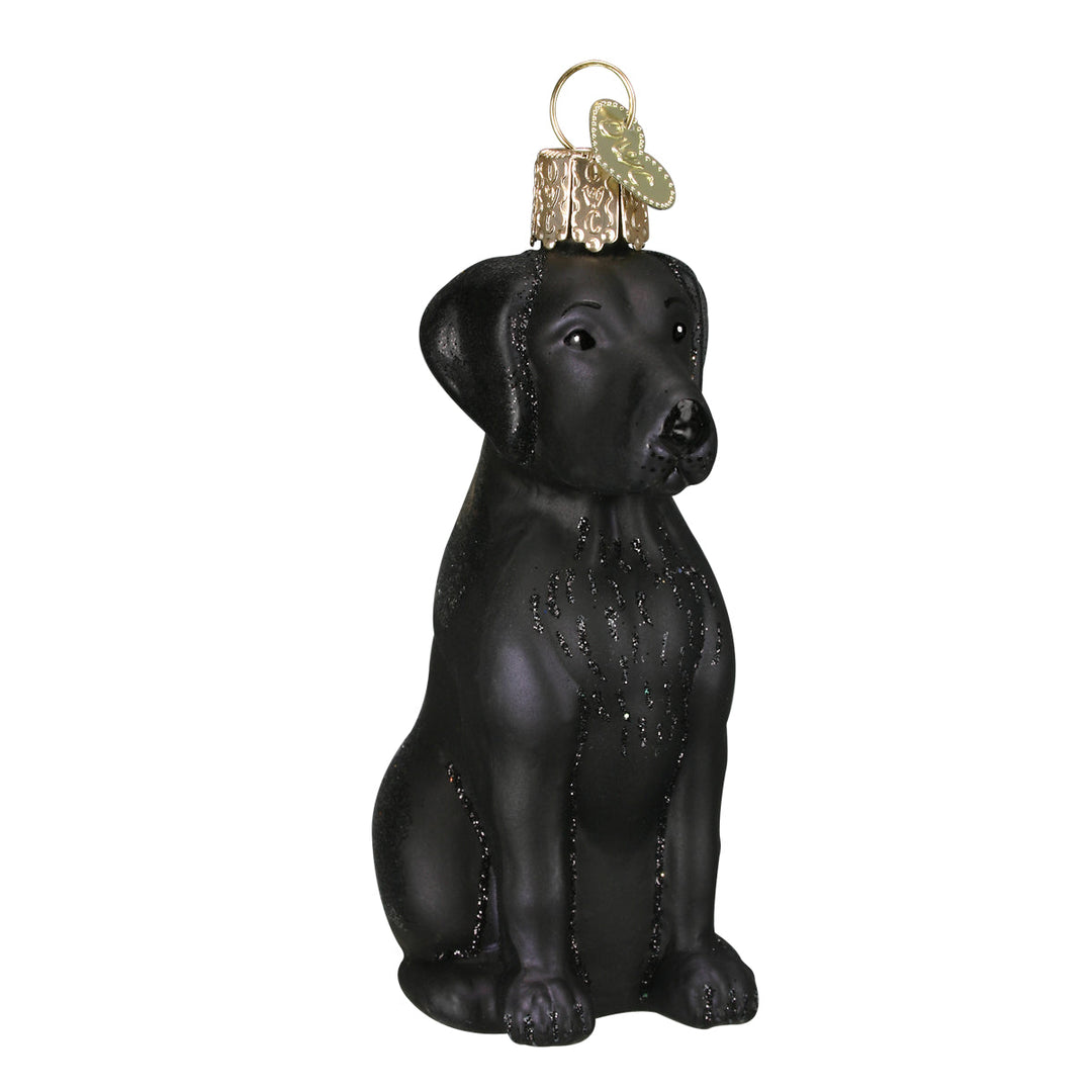 Black Labrador ornament sitting upright in glossy black hand-painted glass, front view