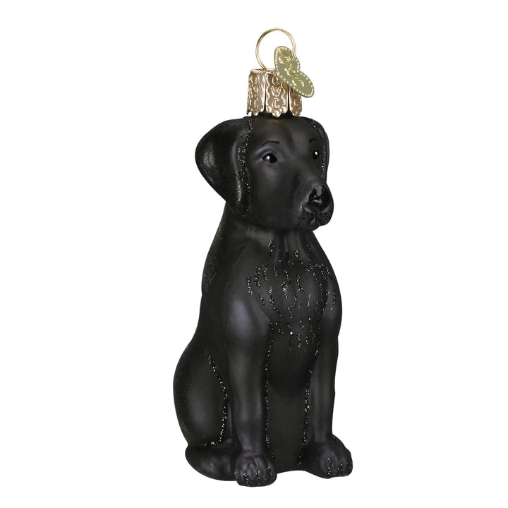 Black Labrador ornament sitting upright in glossy black hand-painted glass, front view