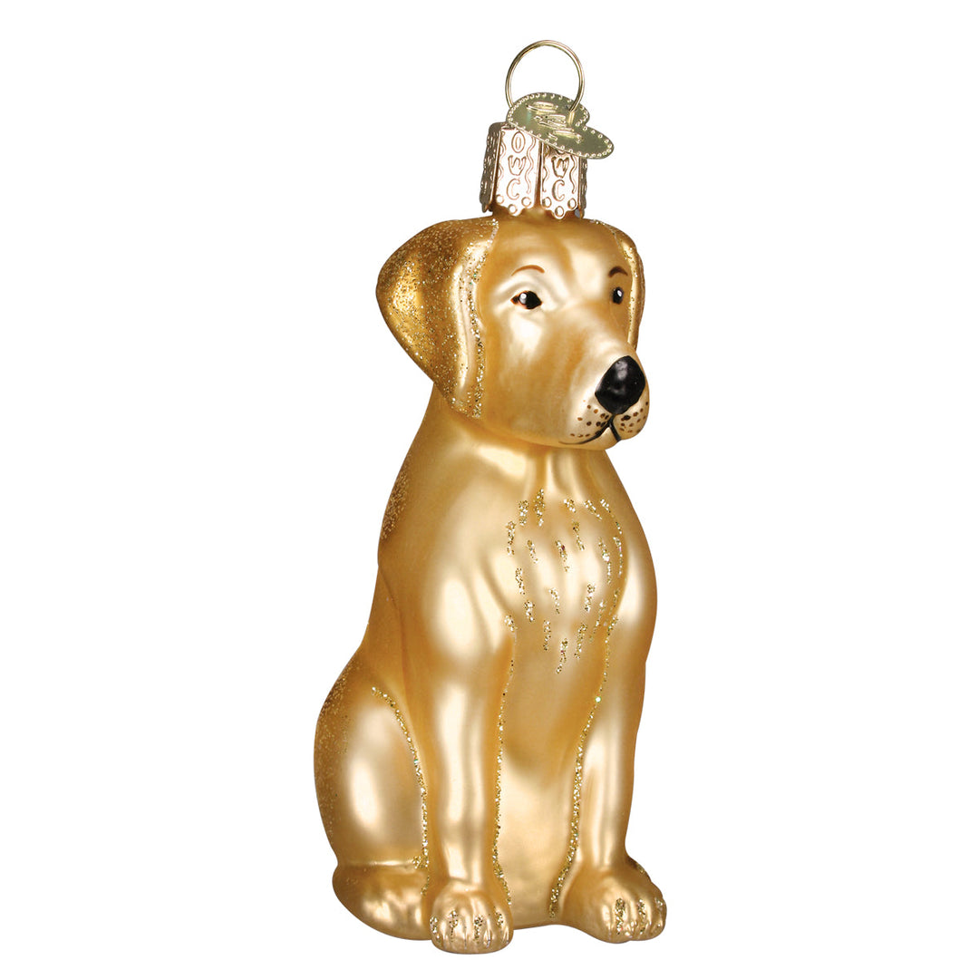 Yellow Labrador ornament sitting upright in golden yellow hand-painted glass, front view