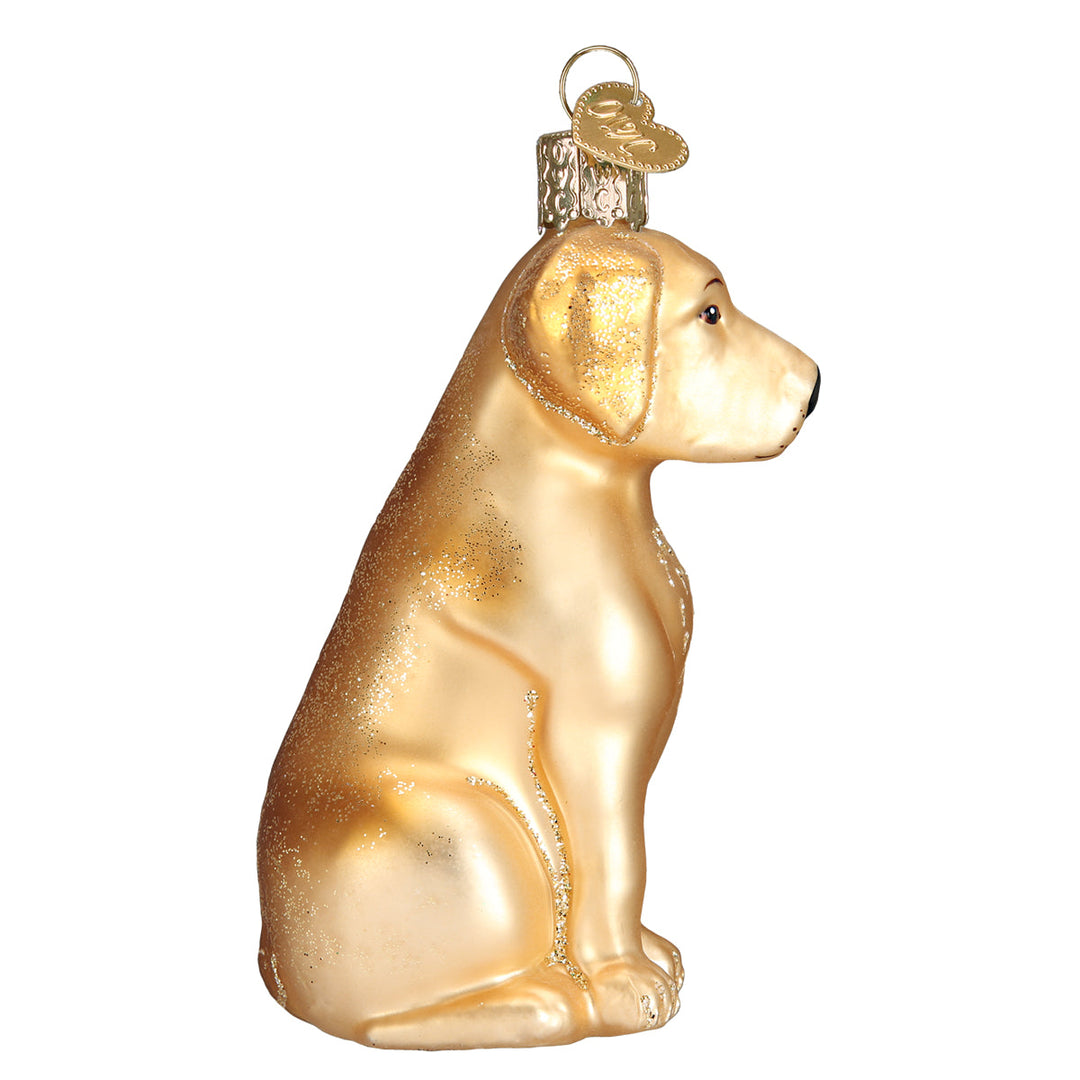 Side profile of the sitting yellow Labrador ornament showing its ears and tail