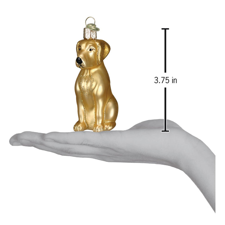Yellow Labrador ornament on an open palm with a 3.75 inch height marker for scale