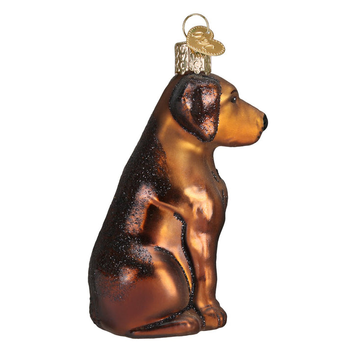 Side profile of the sitting chocolate Labrador ornament showing its glossy brown coat