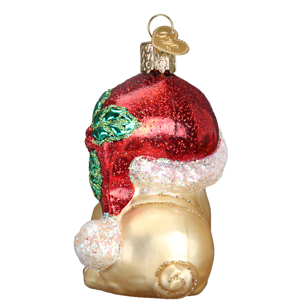 Back of the pug ornament showing the red Santa hat, white pom, and curly tail