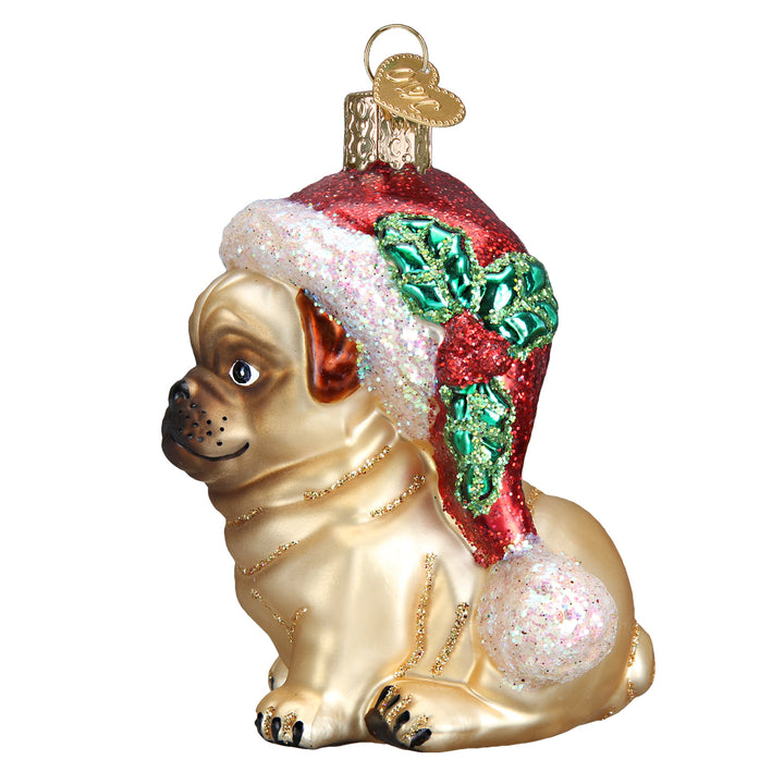 Side view of the pug ornament showing its curled tail and holly-trimmed Santa hat
