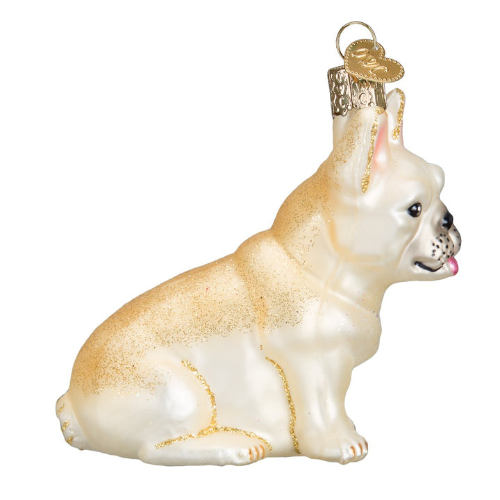 Side view of the sitting French bulldog ornament with a cream and fawn coat, on white