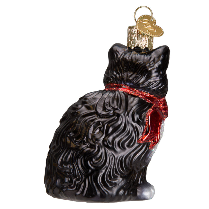 Tuxedo cat ornament, back three-quarter view showing swirled black fur and the red bow tails