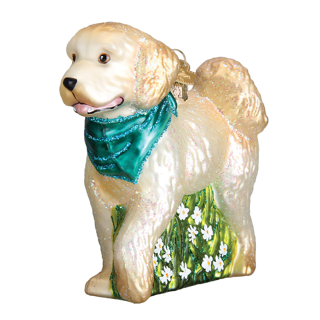 Three-quarter front view of the cream doodle ornament showing its curly coat and teal bandana