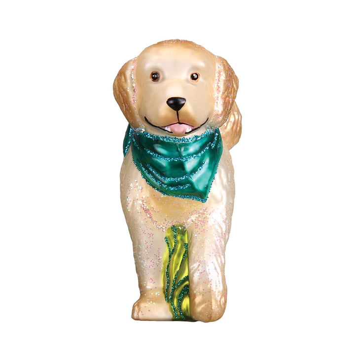 Doodle dog ornament seen head-on with teal bandana and daisy-dotted grass base