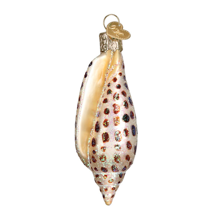 Front of the junonia shell glass ornament showing its peach opening and brown spots, on white