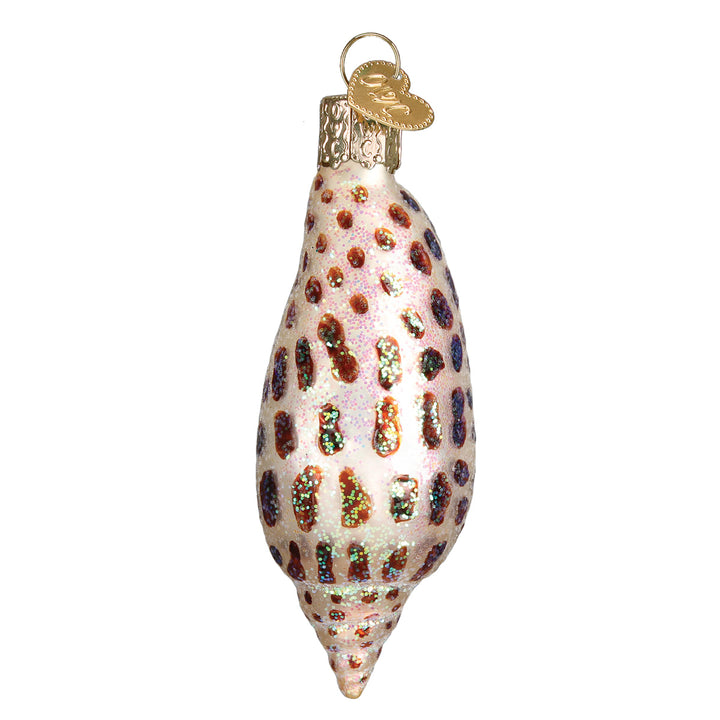 Back of the junonia shell ornament covered in rows of brown glitter spots, on white